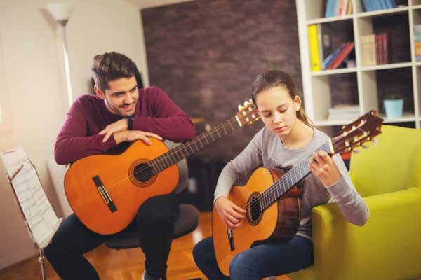 guitar-teacher-teaching.jpg